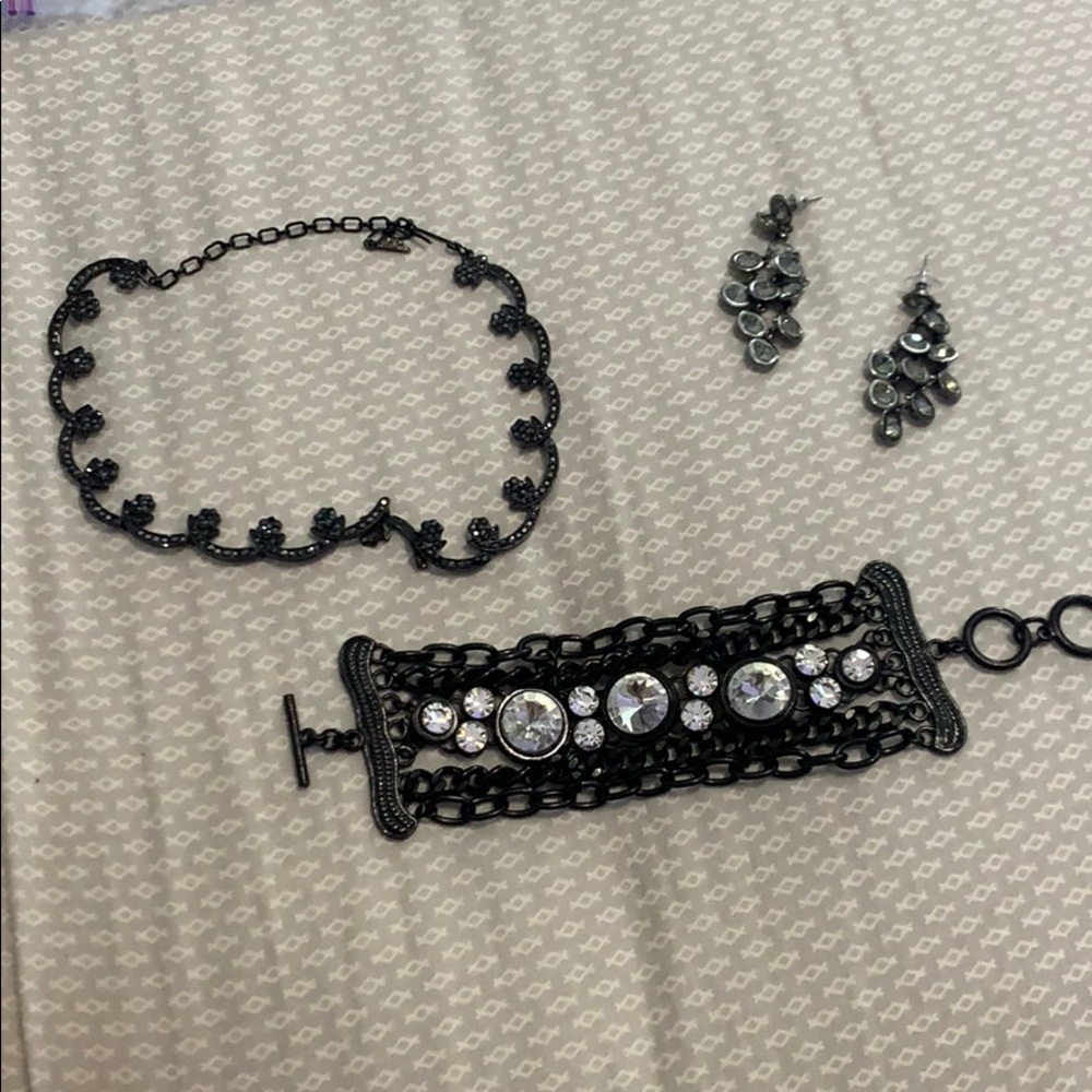 a necklace bracelet and earrings